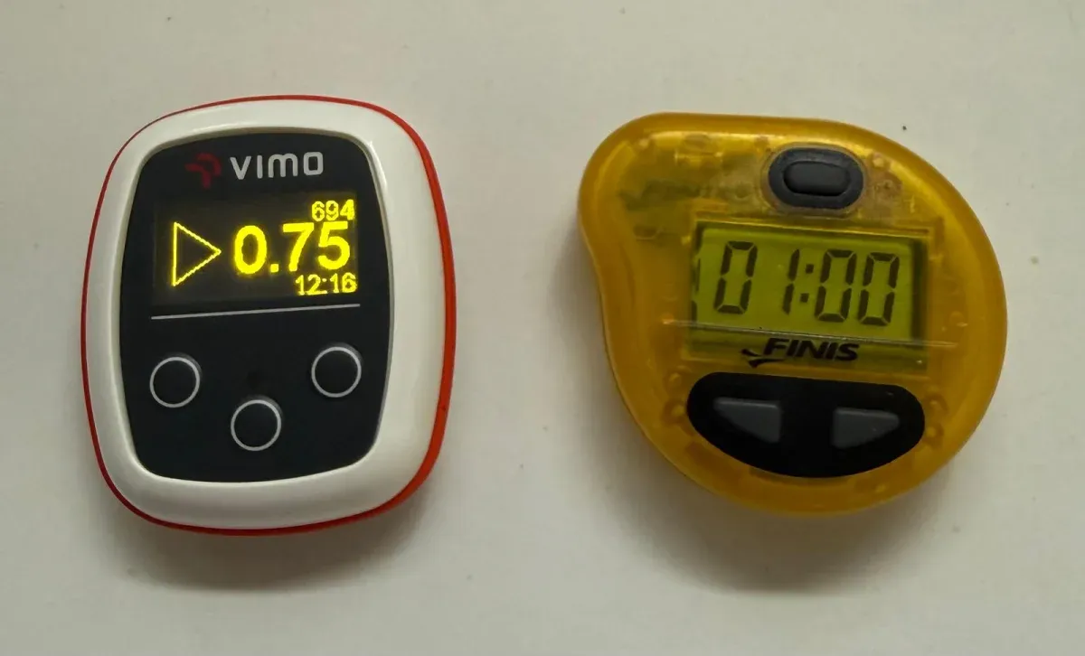 Vimo Swim set to 0.75 s after 694 beeps in 12:16, next to a FINIS Tempo Trainer set to 1.00 s